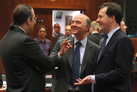 French Finance Minister Pierre Moscovici, center, talks with Swedish Finance Minister Anders Borg, left, and British Chancellor of the Exchequer George Osborne, during the EU finance ministers meeting, at the European Council building in Brussels, Tuesday, May 14, 2013.