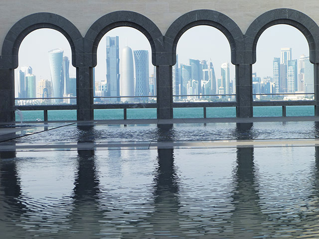 Your Pictures - skylines: Doha skyline through arches with water in foreground