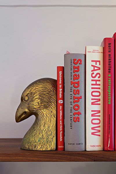 Homes - Pettersen: eagle bookend on shelves with books