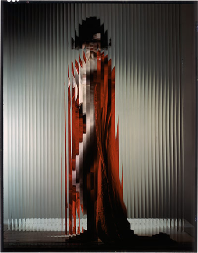 Erwin Blumenfeld: Lisette behind fluted Glass