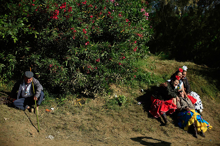 Pilgrims: Pilgrims make a stop after crossing the Quema river on their way to the shr