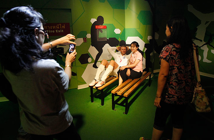 20 Photos: Woman with a waxwork of David Beckham at Madame Tussauds in Bangkok