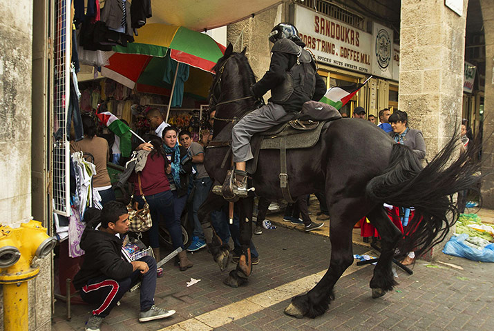 20 Photos: A mounted Israeli policeman disperses Palestinian protestors in Jerusalem