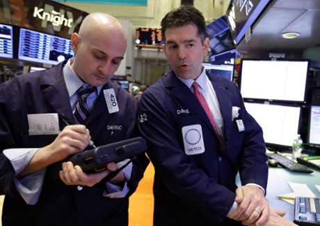 Trader Damian Bagarozza, left, and specialist David Haubner work on the floor of the New York Stock Exchange Thursday, May 2, 2013. Stocks are opening higher on Wall Street, a day after the market's biggest fall in two weeks, after General Motors and other big companies announced higher profits.