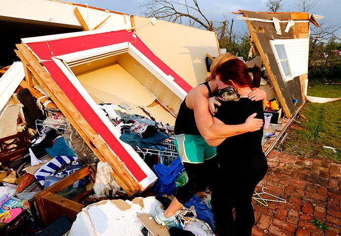 Tornado in USA: Alli Christian, left, returns Jessica Wilkinson's dog 