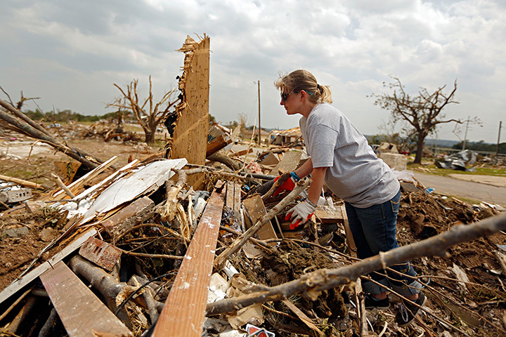 Tornado in USA: A woman searches the remains of her home for valuables in Granbury