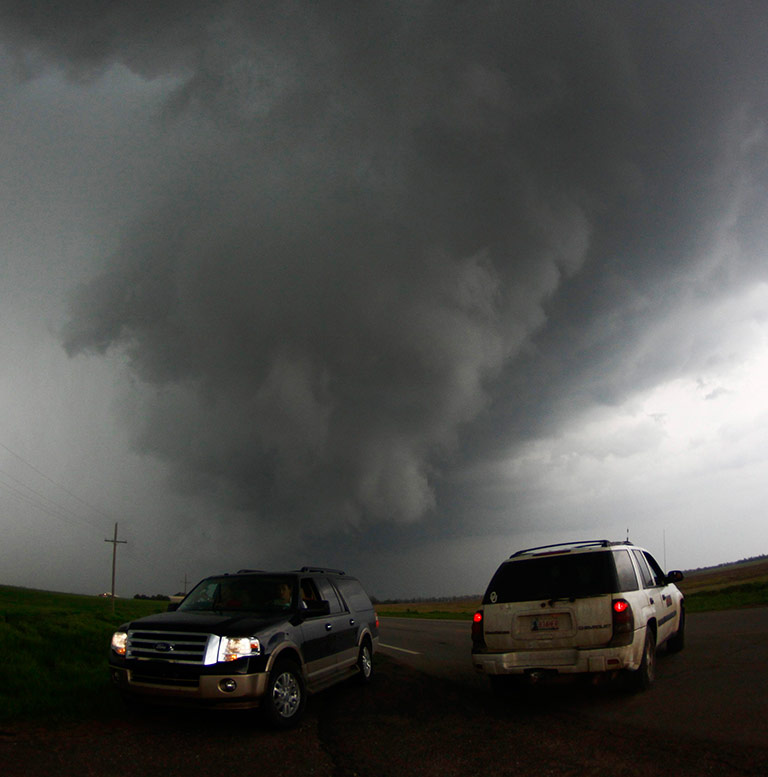 Storm chasers get close to a tornadic thunderstorm, in South Haven, Kansas