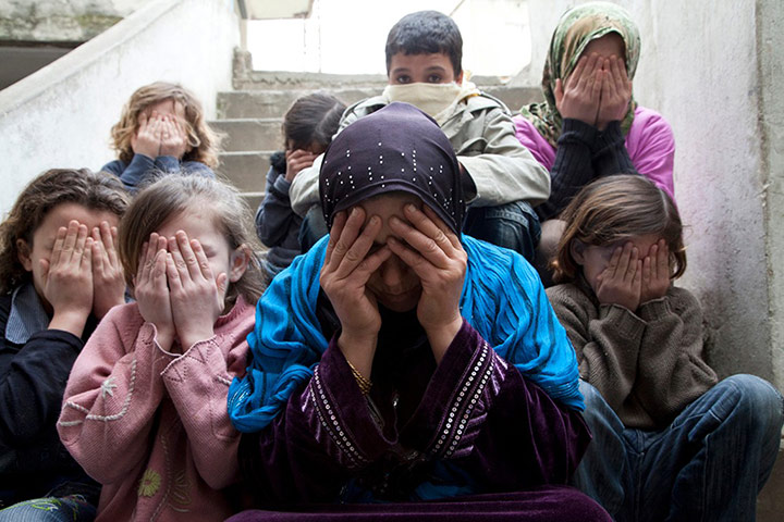 Syria refugees: Syrian mother with children