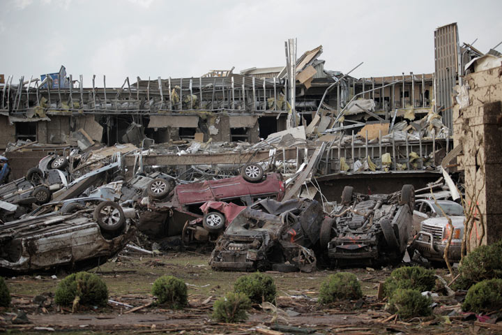 Vehicles are piled up outside the heavily damaged Moore medical centre