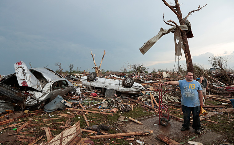 EF-4 update: Philip Gotcher stands in the rubble of his house 