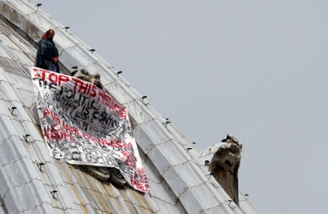 Italian businessman Marcello De Finizio stands on the dome of St Peter's basilica to protest against austerity measures on May 21, 2013 at the Vatican.