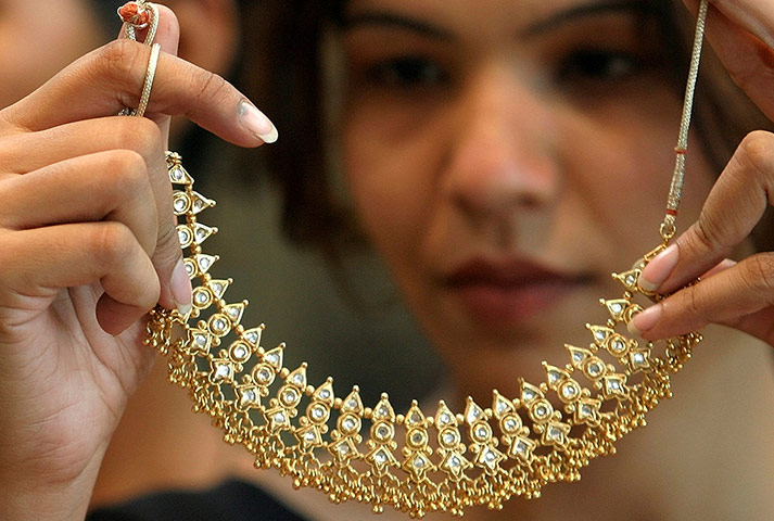 WGC gallery: WGC: Woman admires gold necklace at a jewellery store in Chandigarh