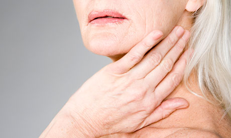 Woman touching her neck