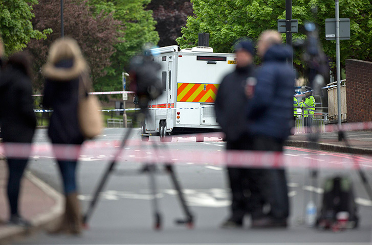Woolwich aftermath: Members of the media stand near the scene in Woolwich where a soldier was 