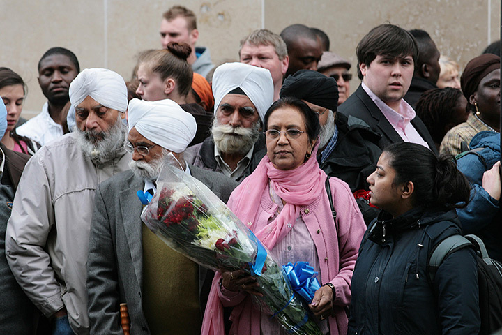 Woolwich response: Members of the Sikh community wait to lay flowers 