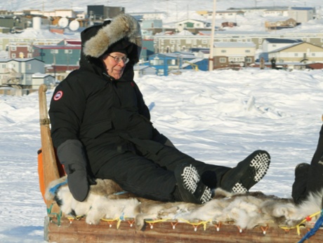 Any excuse to wheel out this picture... Mervyn King riding a dog sled in Canada in 2010. King says the growth vs austerity debate has been exaggerated.