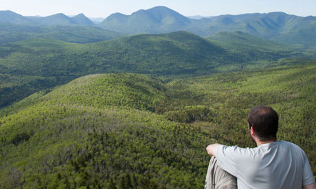 Hiker enjoys the views of Zealand Notch in the White Mountains, New Hampshire USA