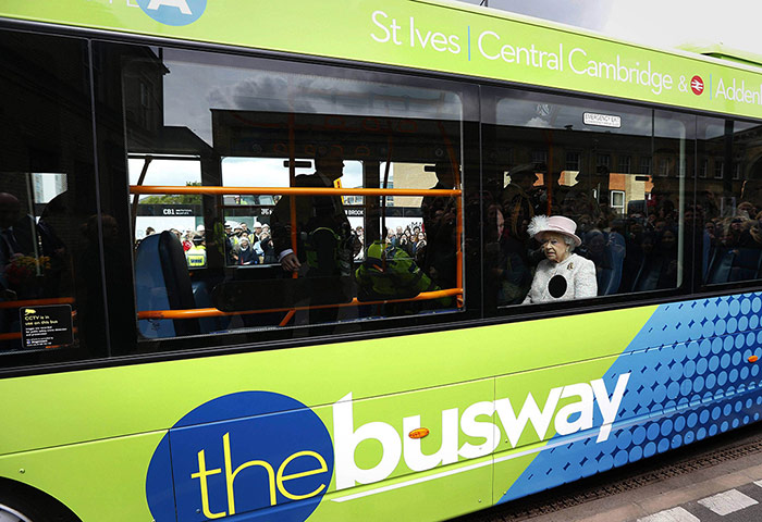20 Photos: Britain's Queen Elizabeth sits in a bus as she arrives in Cambridge