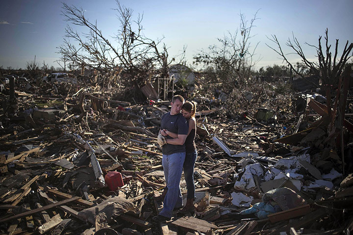 20 Photos: Danielle Stephan holds Thomas Layton after the tornado in Moore, Oklahoma