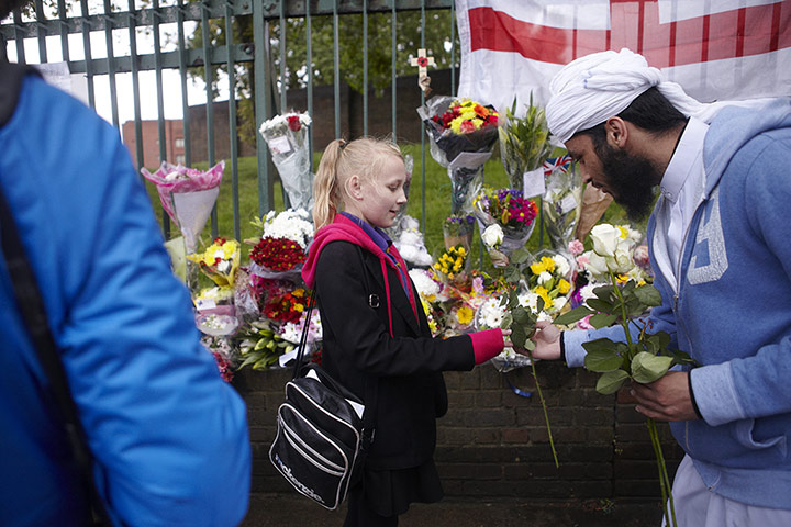 20 Photos: Muslim Council of Coventry representative at the memorial site of Lee Rigby