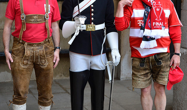 Germans: Bayern Munich supporters pose next to a member of The Queen's Life Guard 