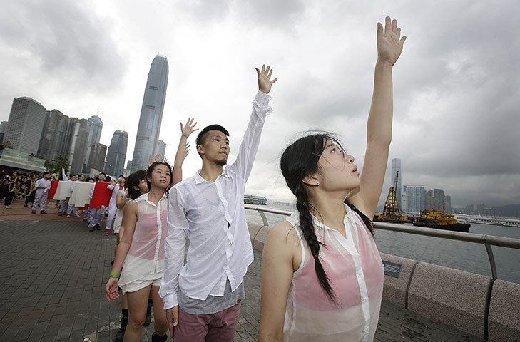 Art Basel: Artists Take Part In Paper Rain Parade To Mark The Opening Of Art Basel
