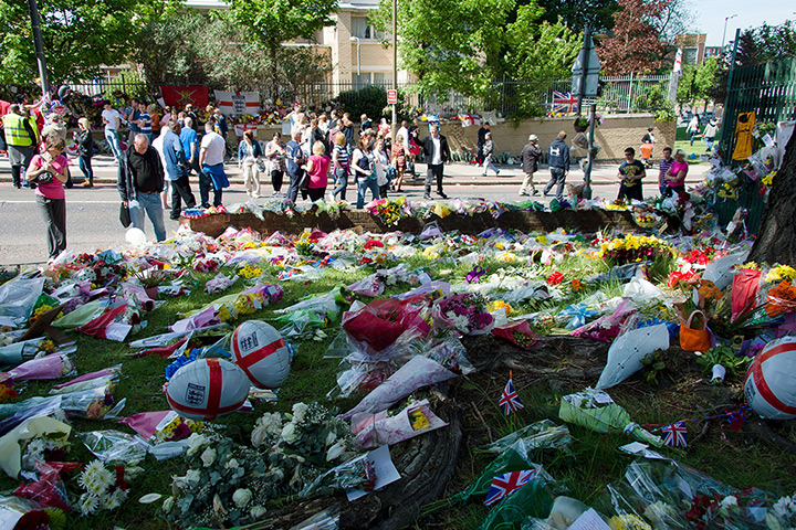 Woolwich tributes: People look at  floral tributes, mementos and messages
