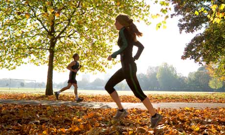 Young woman and man running.