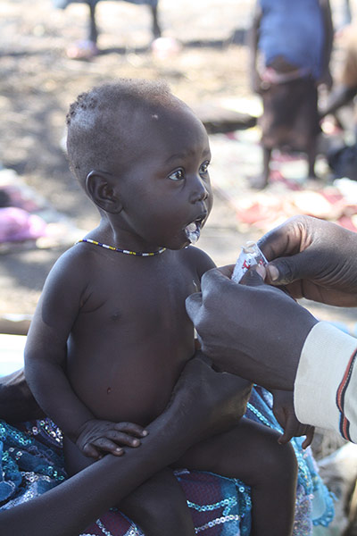 World Hunger Day: Simon Deng feeds Akuol Piol Deng with Plumpy’Nut
