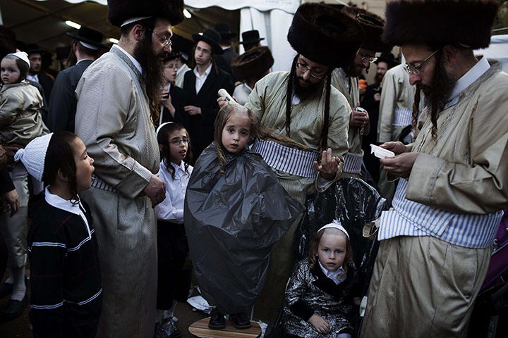 20 Photos: A three-year old Jewish boy takes part in the Jewish holiday of Lag Baomer