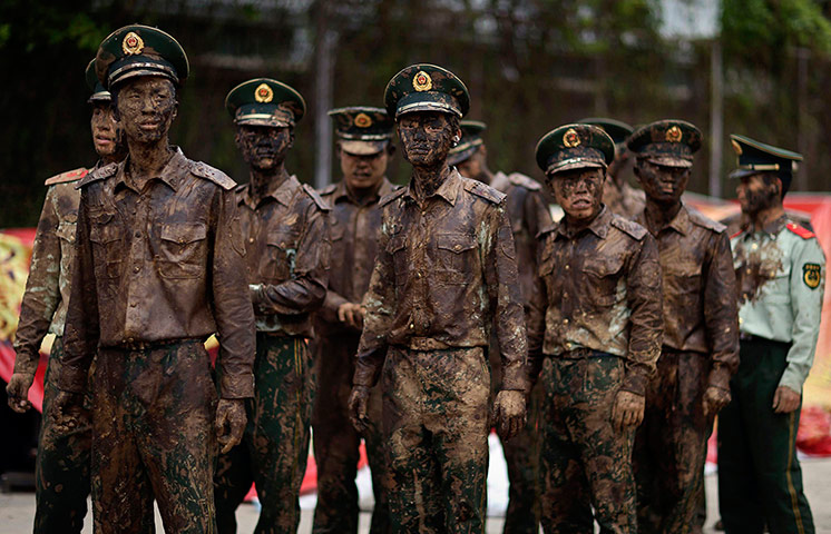 20 Photos: Paramilitary policemen stand guard during Monihei Carnival in Cangyuan