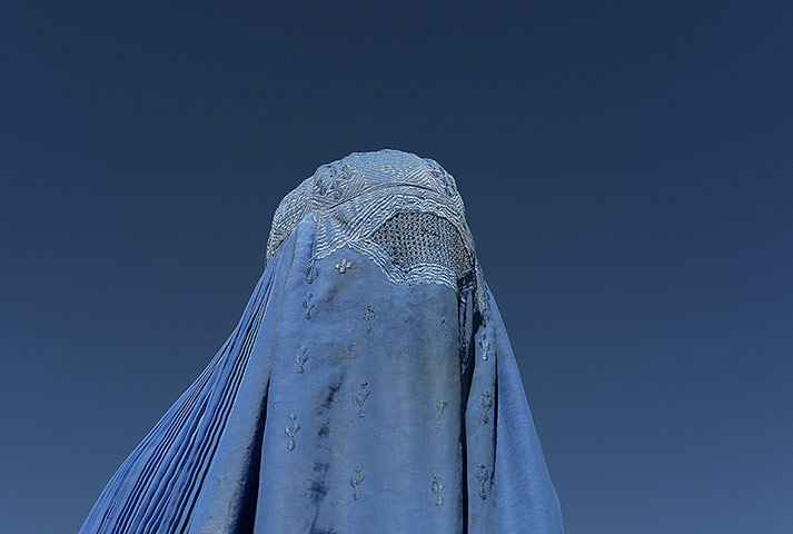 20 Photos: A burqa-clad Afghan protester takes part in a demonstration in Kabul