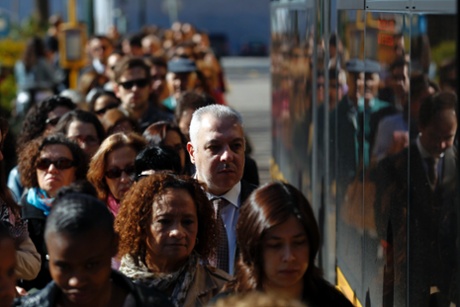 Commuters queue for a bus during a 24-hour subway workers strike, Lisbon, Thursday, May 30, 2013.