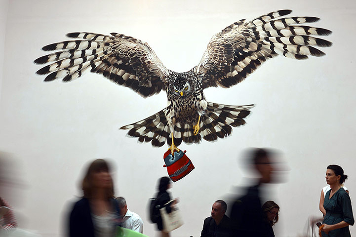 Venice Biennale: visitors look at Jeremy Deller's installation