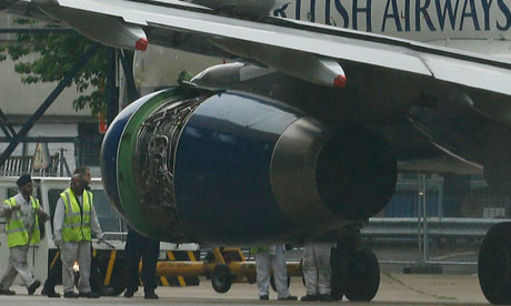 Engineers inspect the damage to BA's Airbus A319 following its emergency landing at Heathrow