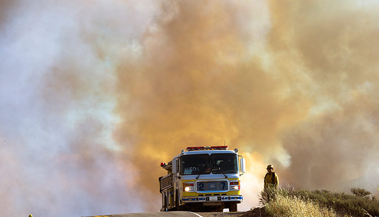 California wildfire: A firefighter near thick smoke