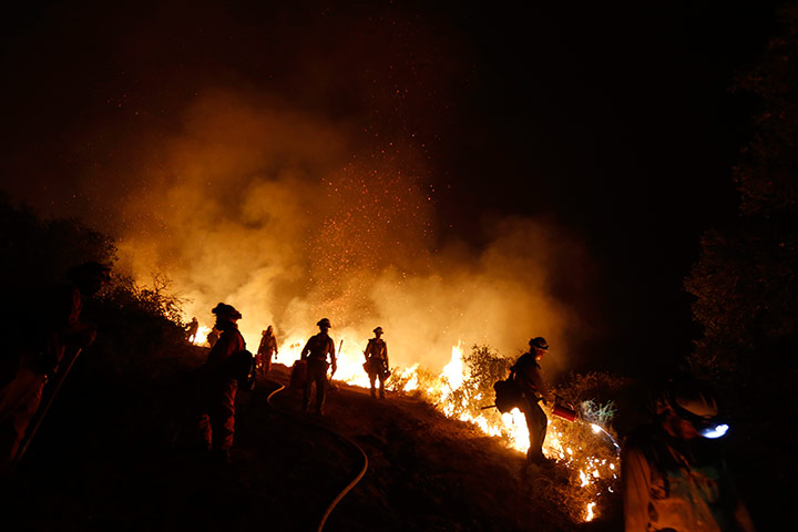 California wildfire: Firefighters work to build a backfire