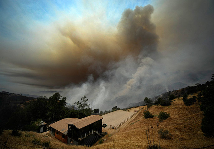 20 Photos: Smoke races through the canyons from the Springs Fire