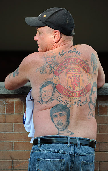 Tom's fergie pics: A Manchester United fan with tattoos of club greats on his back