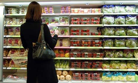A shopper looks at packaged vegetables in Marks and Spencer