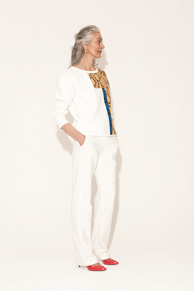 All Ages : white patterned jumper white trousers red shoes