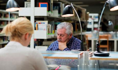 Older man studying in a library