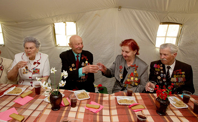 Victory day celebrations: World War Two veterans toast during Victory Day celebrations in the town of