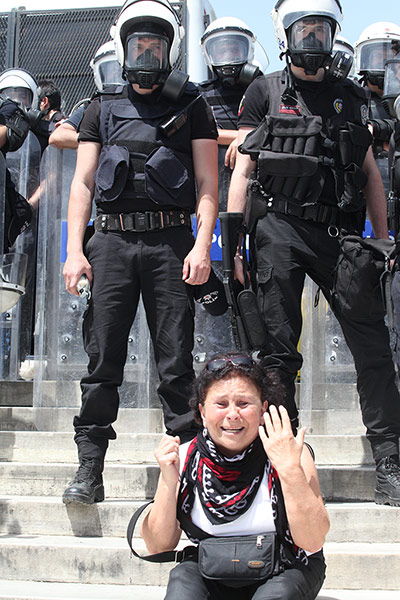 Rioting in Turkey: A woman cries