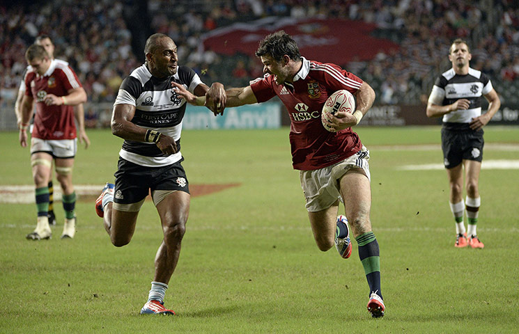 lions: Mike Phillips of the Lions goes past Joe Rokocoko