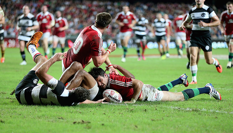 lions: Mike Phillips scores a try