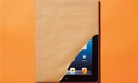 An iPad wrapped in brown paper