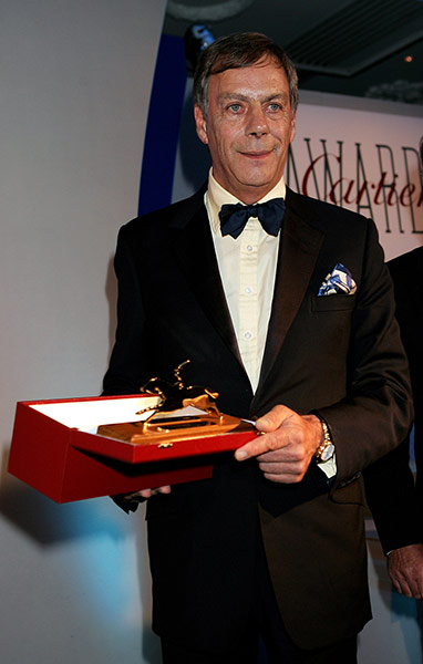 Henry Cecil: Henry Cecil poses with the Award of Merit at the Cartier Racing Awards