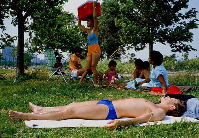 Big Picture - Doug Ischar: man sunbathing with family in background