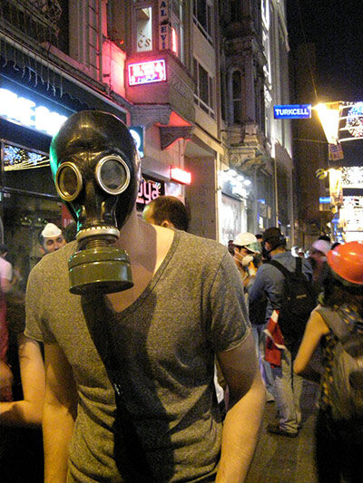 Turkey demonstrations: protestor wears gas mask